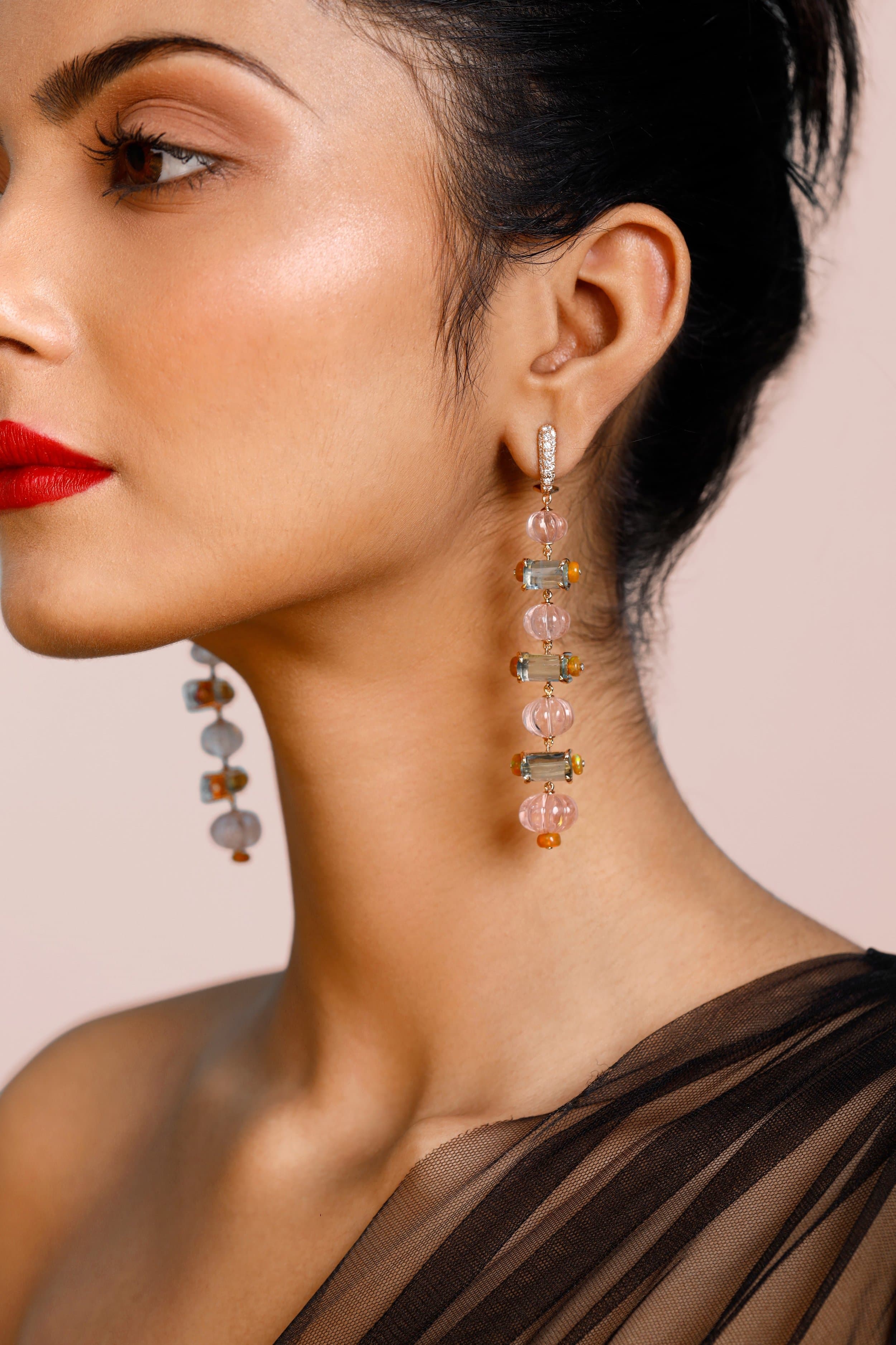 Backlit sage-green vitrines in the Gem Plaza showroom on M.I. Road, Jaipur