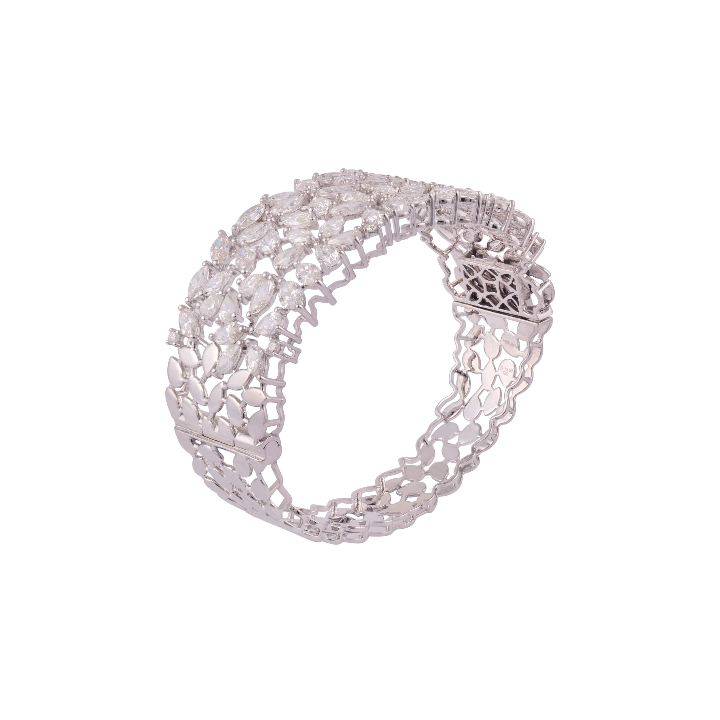 White gold bracelet of overlapping marquise diamonds over a pierced lattice back