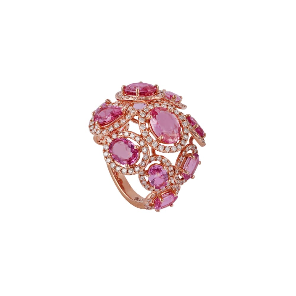 Domed rose gold cocktail ring set with oval pink sapphires in diamond outlines