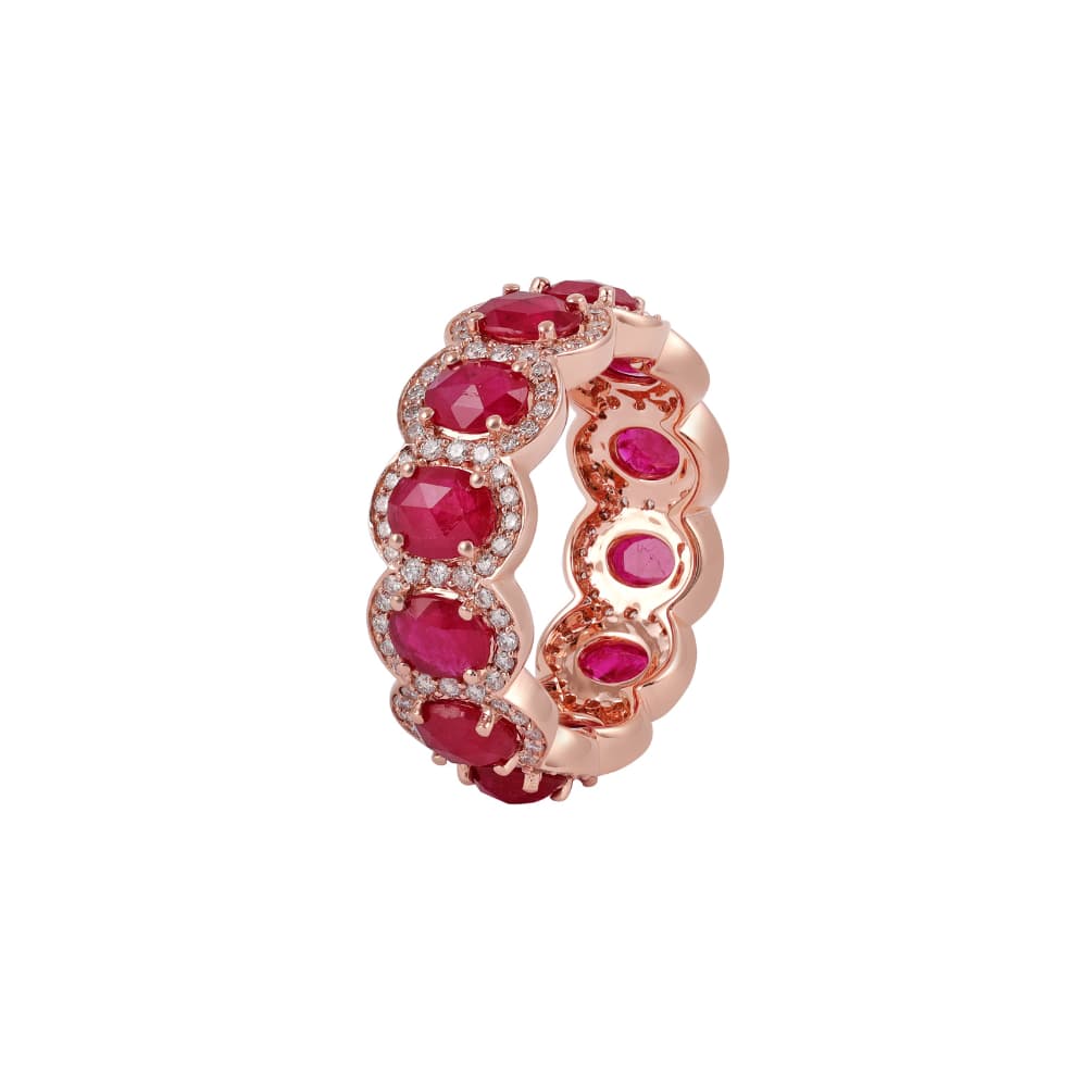 Rose gold eternity ring of oval rubies each framed in small round diamonds