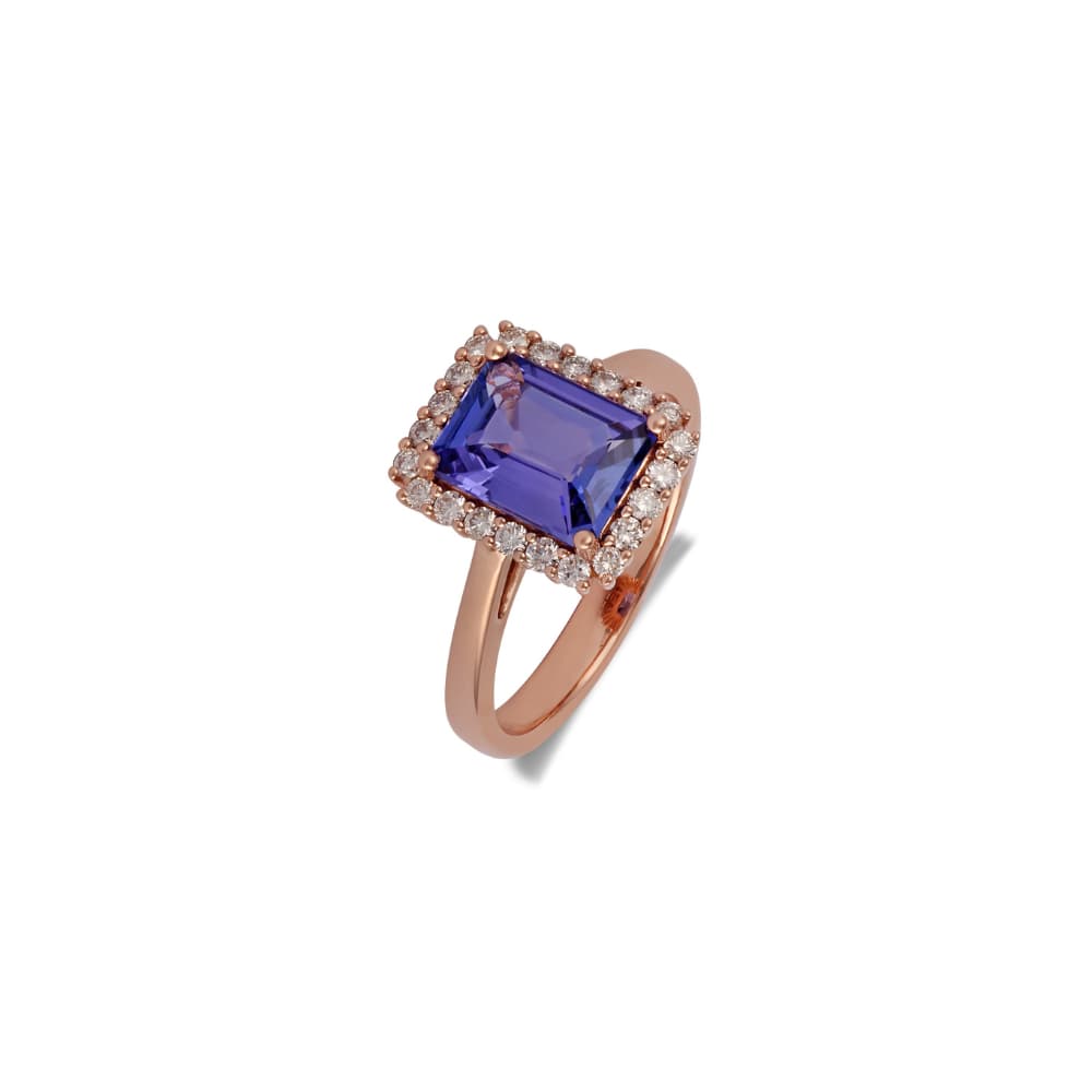 Rose gold ring with an emerald-cut tanzanite set crosswise in a diamond halo