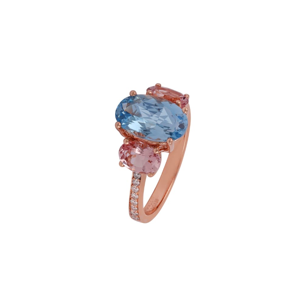 Rose gold ring with a large pale blue oval and two soft pink ovals set on the diagonal