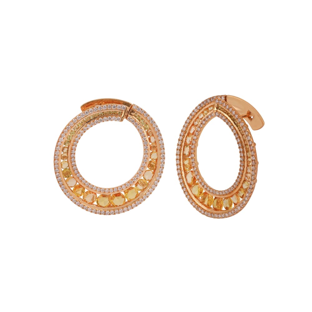 Rose gold spiral earrings with diamond rails and rose-cut yellow sapphires between them