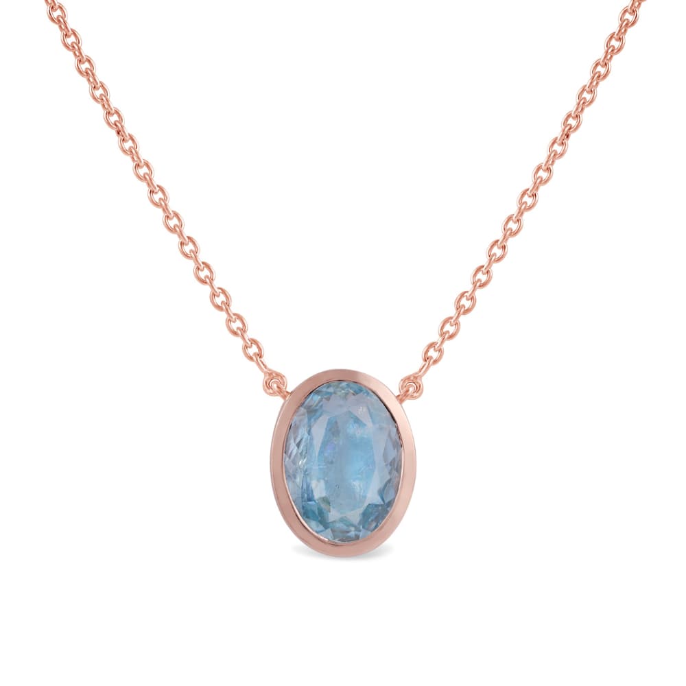 Rose gold chain necklace with a single oval pale blue stone in a plain bezel