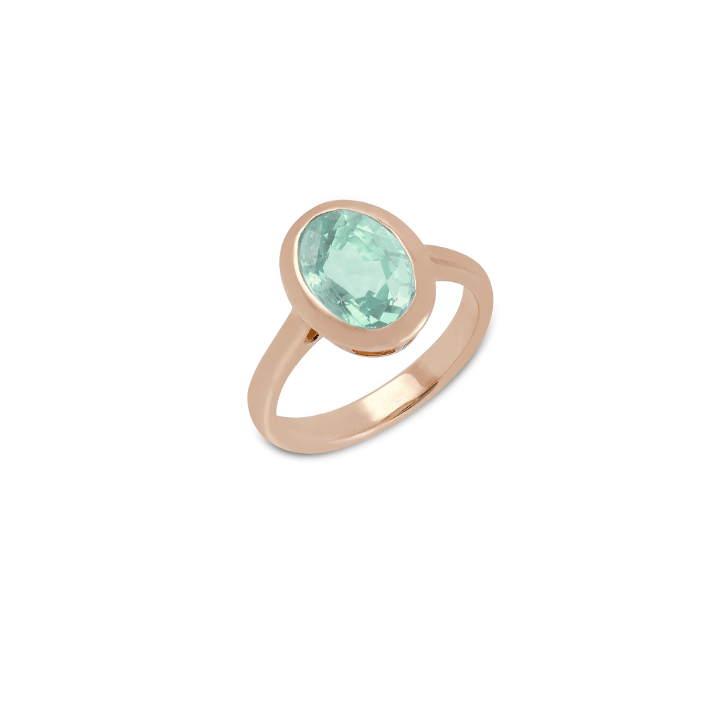Rose gold ring with a single oval mint-green stone in an open-backed bezel