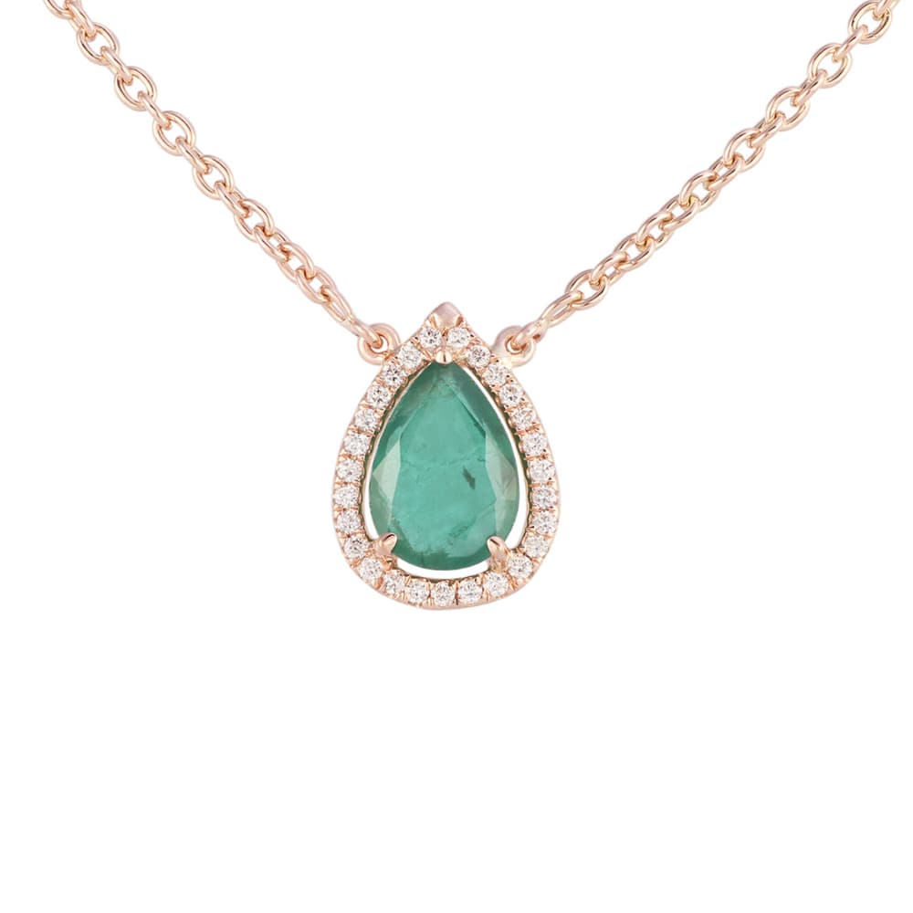 Rose gold necklace with a pear-shaped emerald pendant framed in small diamonds