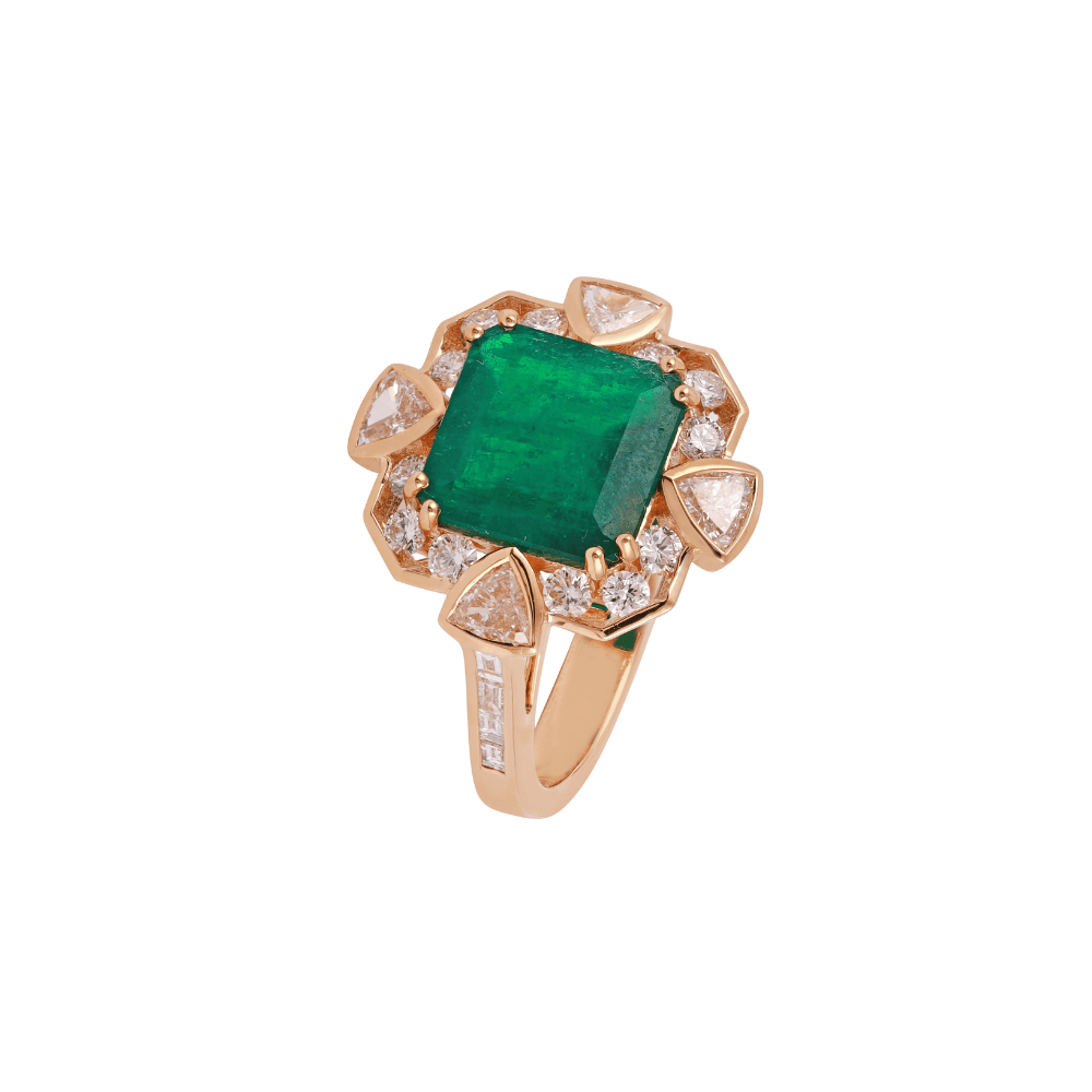 Rose gold ring with an emerald-cut emerald framed by trillion and round diamonds