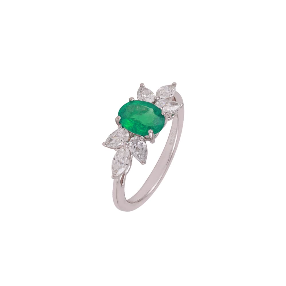 Slim white gold ring with an oval emerald and sprays of marquise diamonds